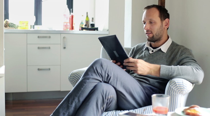 man holding tab